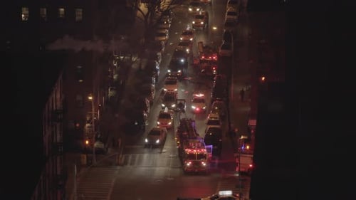 Fire Department Service Truck with Flashing Siren Lights at Night