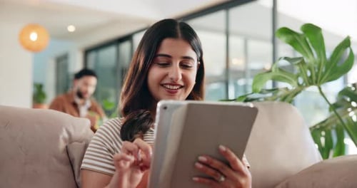 Relax, happy and tablet with woman on sofa for social media post, reading and online update