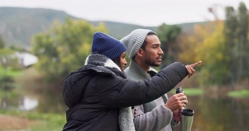 Nature, hiking and happy couple with binoculars, coffee and sightseeing adventure on lake holiday