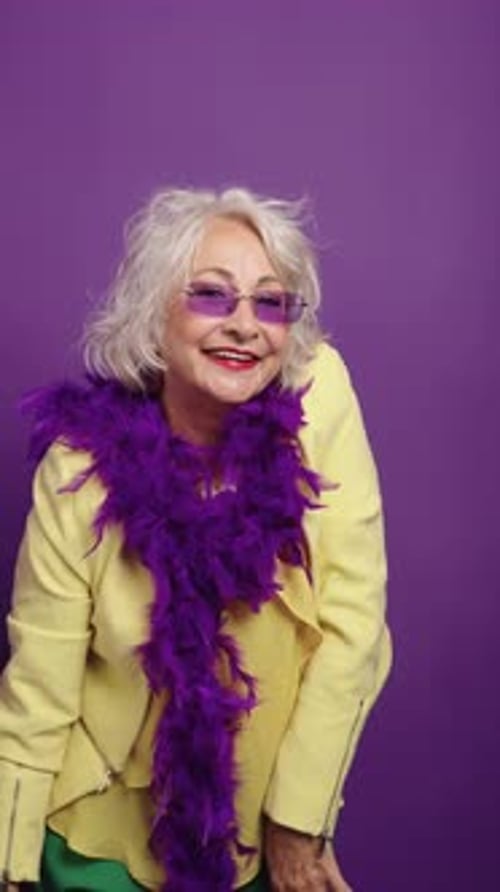Senior Woman Dances With Pom Poms