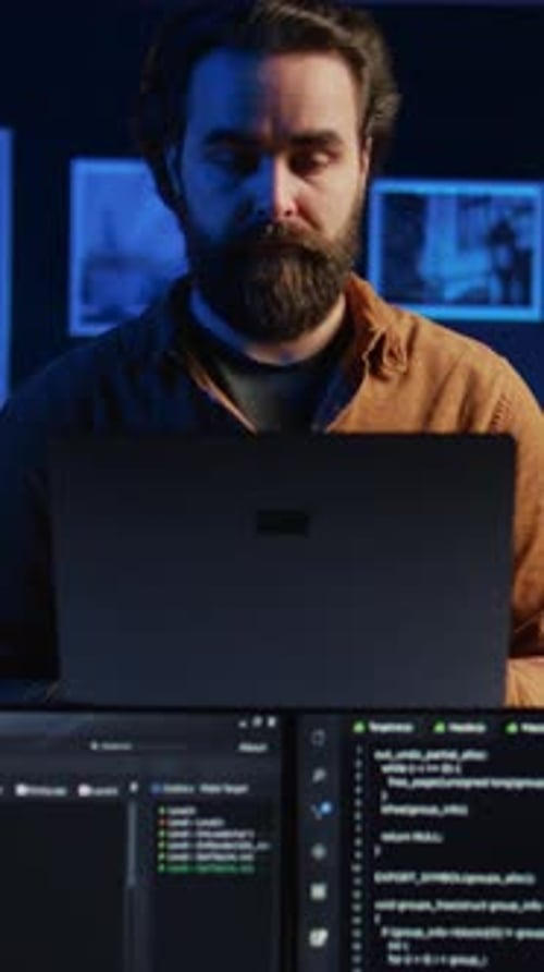 Portrait of Smiling Developer Writing Complex Binary Code Scripts on Laptop