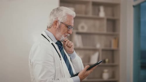 Doctor Using Tablet in Office Environment