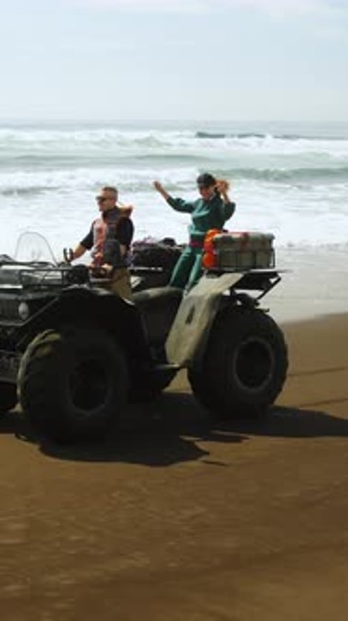 Adventurous Beach Expedition Thrilling Ride on an AllTerrain Vehicle with Friends Enjoying the