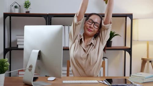 Woman Typing at Computer in Home Office