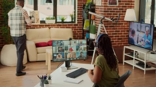 Woman Attends Virtual Meeting in Home Office