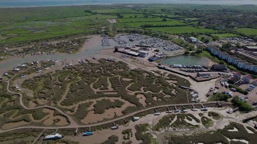 Marshes And Creek In Tollesbury On The Coastline Of Essex In The UK. aerial