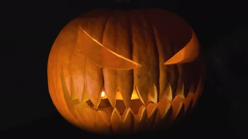 Spooky Jack-O-Lantern Glowing in the Darkness