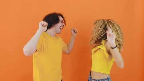 Fun Couple Dancing Together in Studio
