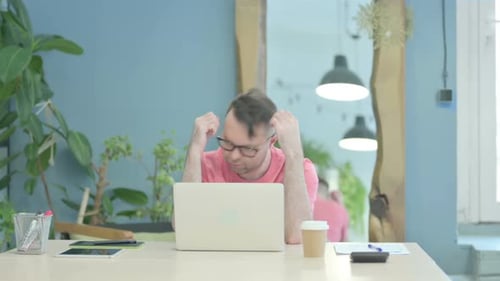 Creative Old Man Reacting to Loss while using Laptop