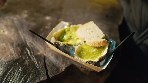 Gourmet Dish Delightful Tender and Flavorful Oysters Served with a Delicious Green Sauce and Crispy