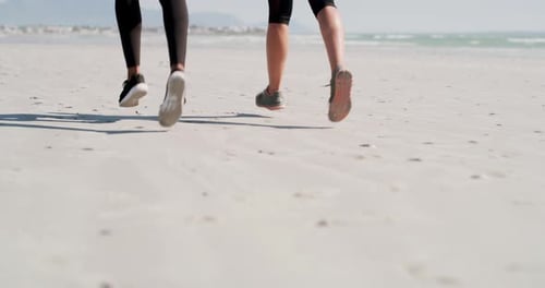 Running, fitness and feet of people on beach for exercise, marathon training