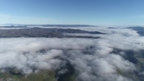 Flying in Sunrise Clouds The Clouds are Moving on Camera Aerial Drone View