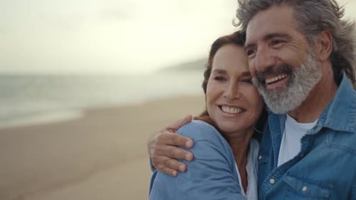 senior couple spending time on the beach