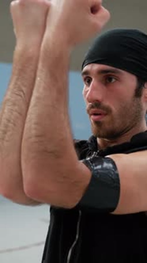 Athlete Moves Arms Biceps After Warming Up Basketball Court
