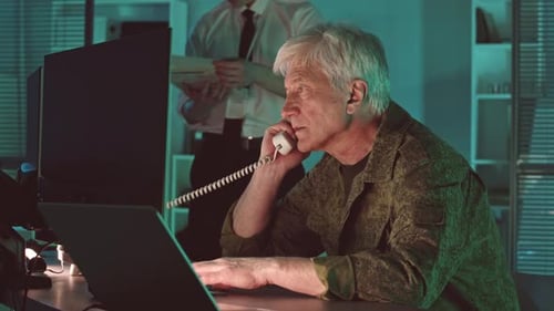 Mature Man Working on Computer at Night