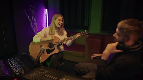 Woman Singer and Producer in Recording Studio Lady Guitarist Singing Song Audition and Meeting of