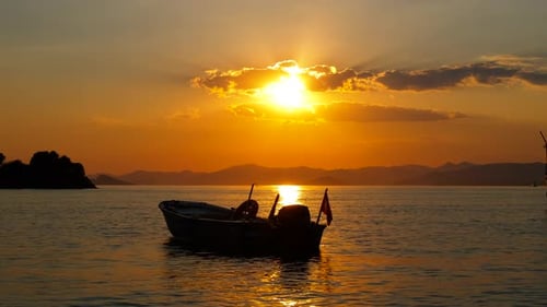 Boat on the Sea at Golden Hour Sunset