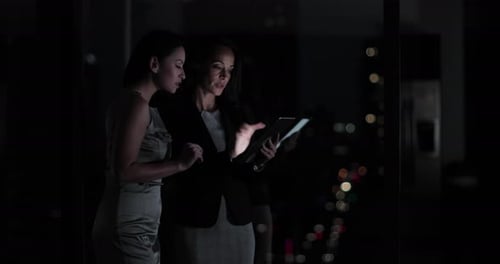 Conceptual shot of businesswomen with infographics digital composite