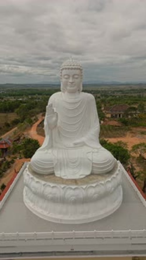 Great White Buddha statue aerial vertical footage.