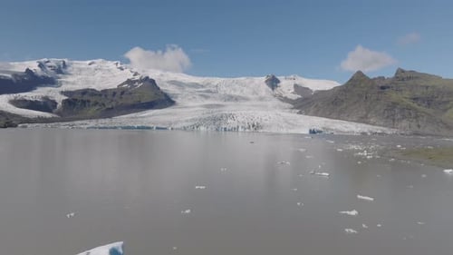 Aerial view flying above of the glacier edge breaking in Iceland