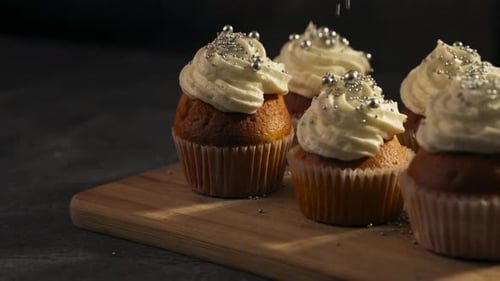 Delicious Cupcakes with Frosting and Silver Sprinkles