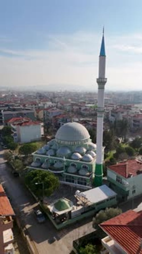 Vertical Aerial View of Mosque and Agricultural Fields with City in Background