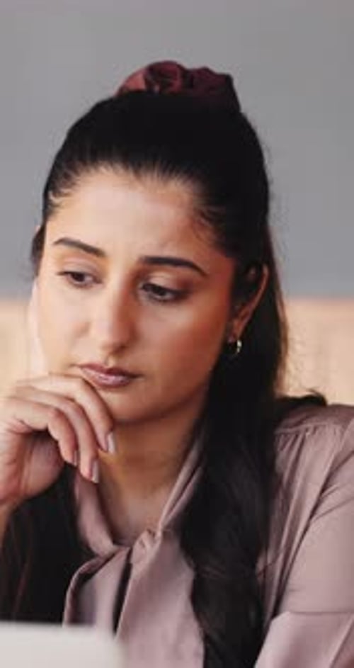 Thinking, laptop and businesswoman in office with planning, decision or choice for creative project