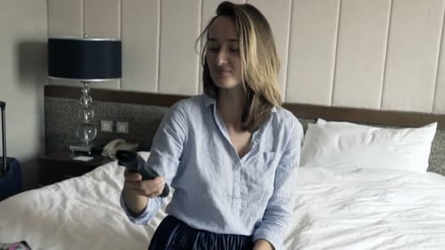 Attractive Businesswoman Watching Tv During Breakfast in Hotel Room 30s