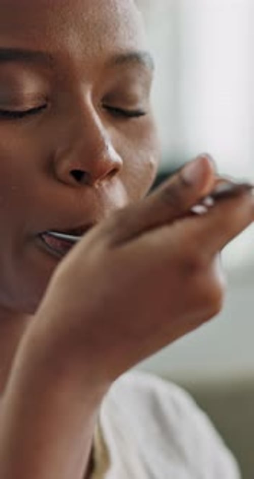 Woman Eating and Savoring the Flavor