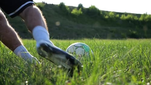Male Foot of Professional Footballer Shooting a Penalty Kicks on Stadium on Sunny Day Leg of