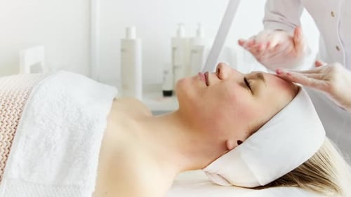 Woman Getting Facial at Day Spa