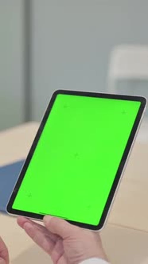 Close Up of Senior Doctor Using Digital Tablet with Green Screen, vertical video