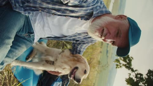 Vertical Video Joyful Retirement Online Call With Dog in Scenic Nature