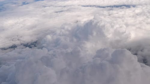 Flying over the clouds, view from a plane