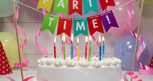 Celebration Cake with Burning Candles Zooming In