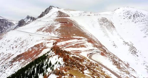 Driving through winding rocky mountain roads on a Colorado winter adventure