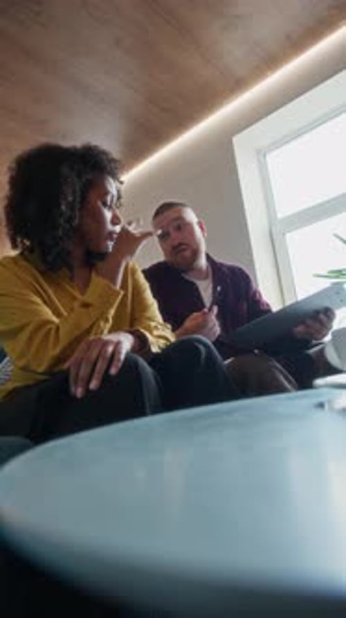 Female Manager Signing Contract Meeting with Male Colleague in Office