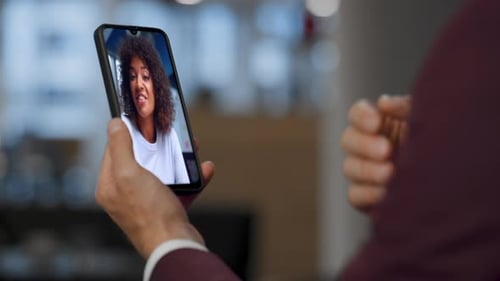 Man Holding Phone Video Chatting with Woman