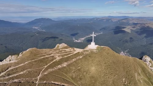 View of the Cross of Heroes on Mount Caraiman in the Bucegi Mountains, Romania