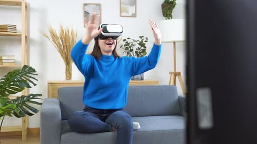 Young Woman Using VR Headset in Living Room