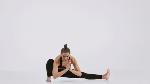 Active Woman Practicing Yoga Stretches for a Healthy Lifestyle Indoors