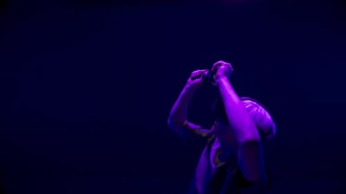 Person Using VR Headset With Controllers