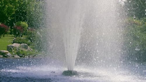 Fountain Water in . Beautiful High Fountain in Garden. Fountain Splash