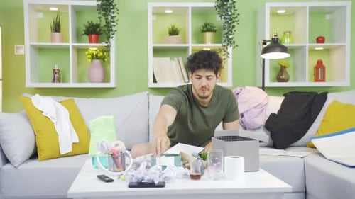 Young Adult Relaxing on Couch Makes Phone Call