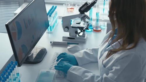 Scientist Working in a Bright Laboratory