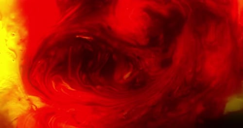 Vibrant Red and Yellow Ink Swirl Abstractly