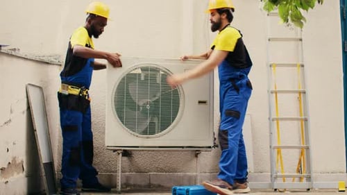 Mechanics Opening Rusty Air Conditioner