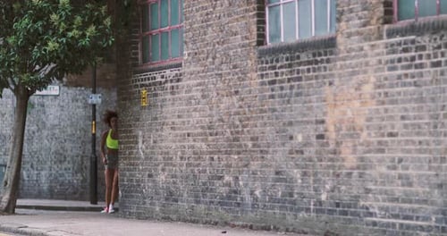 Young adult females running in urban city
