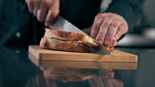 Cutting a Grilled Cheese Sandwich on Cutting Board