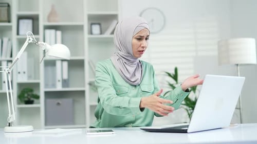 annoyed young woman looking at laptop screen, irritated by bad low internet connection frustrated wo